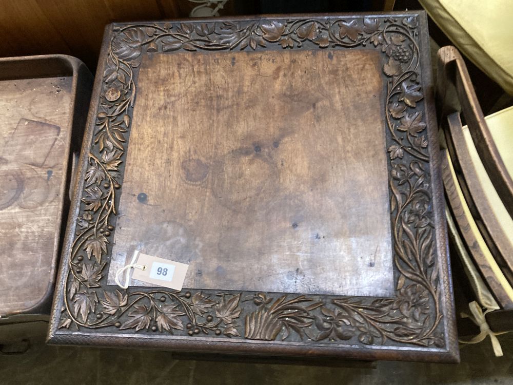 An Indian carved hardwood revolving bookcase, width 53cm, depth 53cm, height 75cm